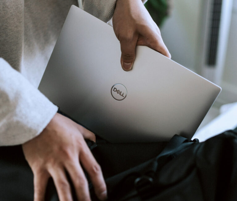 Cloud infrastructure migration consultant with Dell laptop planning cloud services